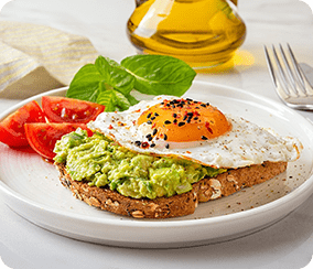 Healthy avocado toast with egg and vegetables
