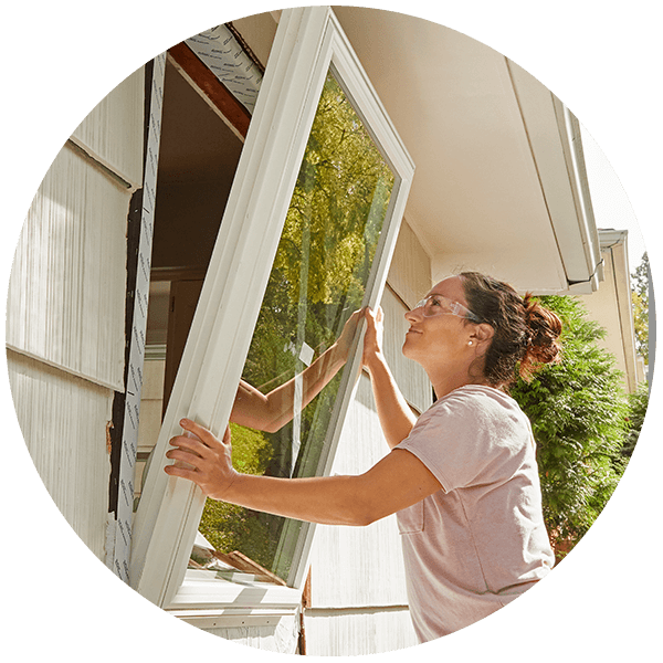 Woman installing window